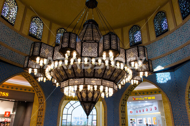 Famous places and landmarks, interior designs and decorations, lighting, decorations and accessories, close-up of a giant chandelier hanging from the ceiling, authentic oriental Arab heritage, Ibn Battuta Mall in Dubai, United Arab Emirates