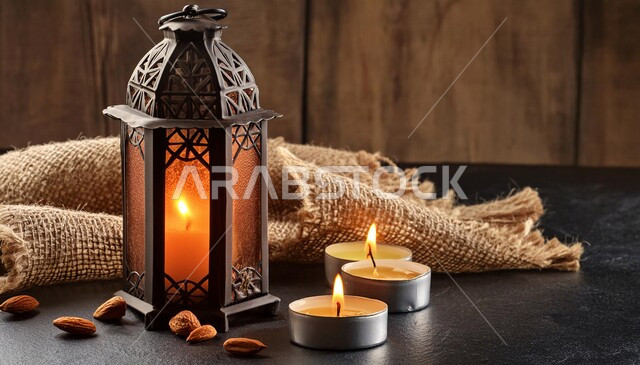 Luminous decorative metal lantern, popular traditional lighting and lights, decorations and decorations for celebrating Islamic religious occasions and holidays, preparing and preparing to welcome the holy month of Ramadan, brown background