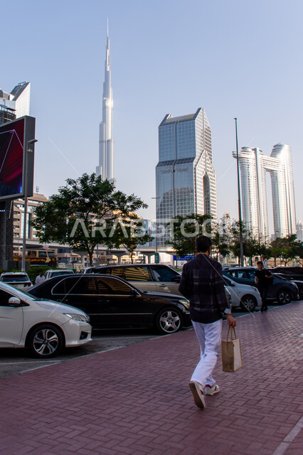 The architectural engineering art of buildings and facilities in the United Arab Emirates, the urban growth and development of towers and skyscrapers on Sheikh Zayed Road in the city of Dubai, famous tourist attractions in the city of Dubai, places of enjoyable recreational tourism during the day, the tallest towers in the world, Burj Khalifa.