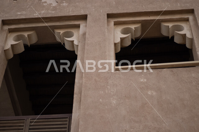 Old style architectural art, close-up of windows in a heritage building, historic city of Dubai, famous tourist attractions, historic buildings in Shindagha area in Dubai Creek District, United Arab Emirates