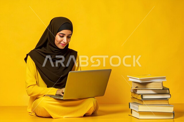 The quality of education and the development of educational methods in the Kingdom of Saudi Arabia, the use of modern technical devices, the concept of distance education and work, a close-up portrait of a veiled Saudi Arabian Gulf girl, smiling, working on a laptop, yellow background