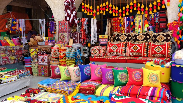Famous tourist attractions in the State of Qatar, traditional popular markets, attractions for tourists from all over the world, a shop selling carpets and pillows in Souq Waqif