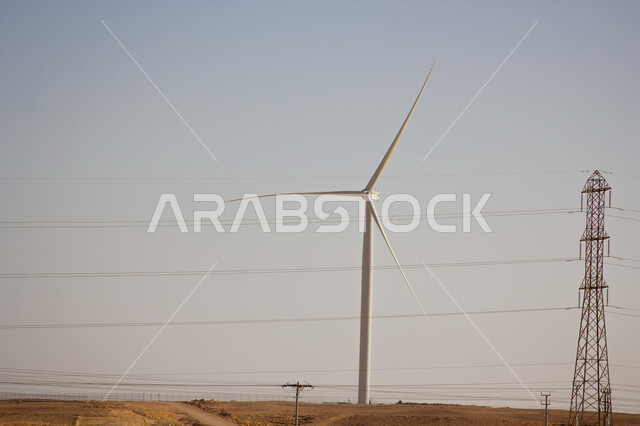 مفهوم استخدام الطاقات المتجددة صديقة البيئة، التنمية المستدامة بالطاقة البديلة في المملكة العربية السعودية، حقول توربينات الرياح وطواحين الهواء وسط الرمال الذهبية في المناطق الصحراوية