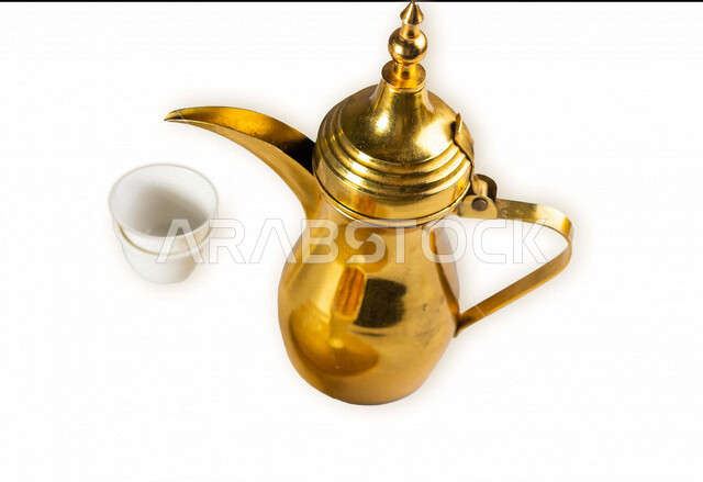 Portrait of an Arab coffee pot with an empty coffee cup, Arab hospitality, Ramadan hospitality, white background