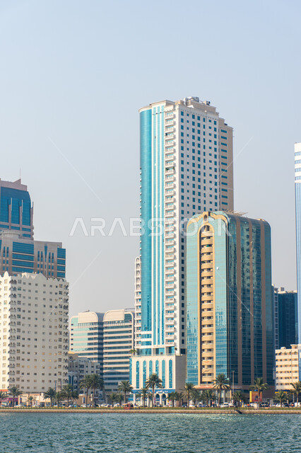 Architectural engineering art of buildings and structures overlooking the sea, the growth and urban development of towers and skyscrapers in the United Arab Emirates, famous tourist attractions in Dubai, the waterfront on the coast of the Arabian Gulf