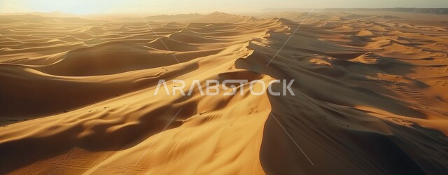 Sunset over soft sand and golden sand dunes, highlands, terrain and mountain peaks in the prairie, rock formations and formations in the desert of Saudi Arabia, desert areas and desert natural environment, nature background