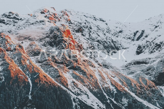A landscape of the scenic beauty of nature, a high mountain peak covered with wonderful white snow, landscapes.
