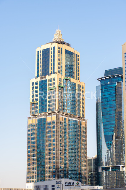 Modern architectural style of towers and skyscrapers, concept of urban growth and development of buildings and facilities in Dubai Marina in the United Arab Emirates, a high-rise building with a distinctive design during the day, famous tourist attractions, a destination to attract tourists