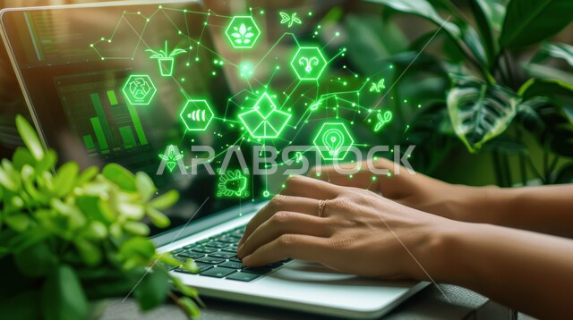 Electronic development and technological growth in the field of artificial intelligence, modern digital technology, holographic digital symbols for green environmentally friendly holographic icons, close-up image of the hand of a Saudi Arabian Gulf man working on a laptop, working in alternative and renewable energies