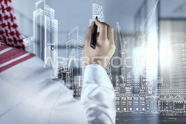 A close-up image from the back of the hand of a Saudi Gulf man, an architect, who is drawing an engineering architectural drawing through 3D hologram technology.