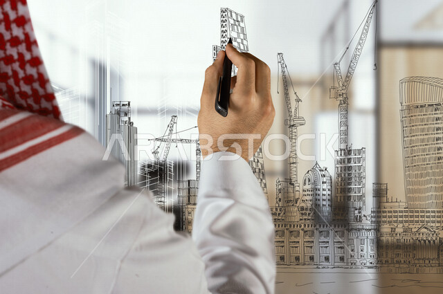 صورة مقربة من الخلف ليد رجل خليجي سعودي ، مهندس معماري يقوم برسم يدوي معماري ثلاثي الابعاد ، تخطيط معماري هندسي ، سكتش يدوي .