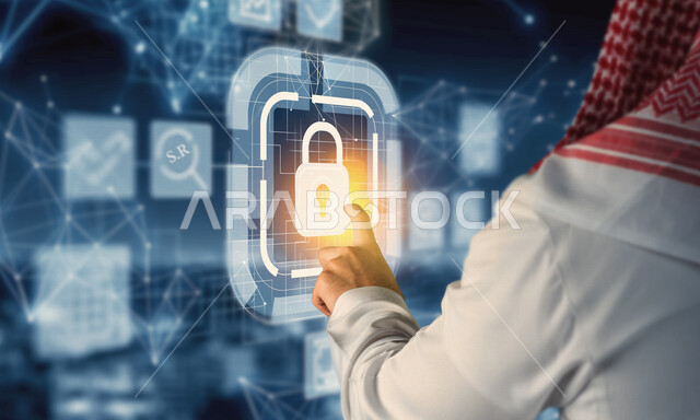 صورة مقربة من الخلف ليد رجل خليجي سعودي ، يضغط بأصبعه  لفك قفل الامان بتقنية الهولوجرام ، مجموعة من الأشكال والاطارات الهندسية بتقنية الهولوجرام ، استخدام خاصية الهولوجرام ثلاثية الأبعاد .