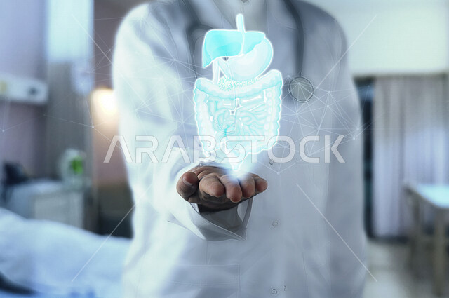صورة مقربة ليد طبيب خليجي سعودي يحمل فوق يده الجهاز الهضمي للانسان محاطة بشبكة عنكبوتية من خلال تقنية الهولوجرام ، ثلاثية الأبعاد .