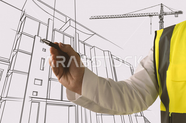 A close-up picture of a Saudi Arabian Gulf man, an architect in the workplace and the project, with a pen in his hand and explaining the design mechanism.