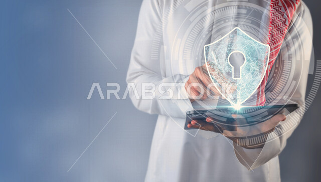 A close-up of a Saudi Arabian Gulf man holding a smart technical device with an icon for the safety lock surrounded by a photographic lens Hologram technology, using the 3D hologram feature.
