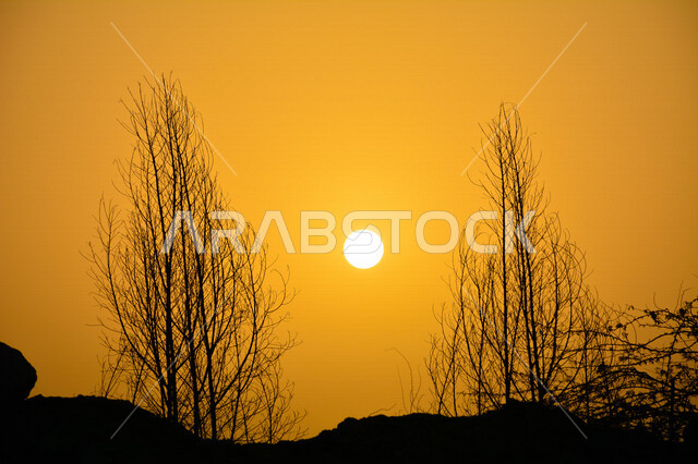 Scenic aesthetic picture of orange sunset, creative sunset from the desert, scenic beauty of desert nature at sunset