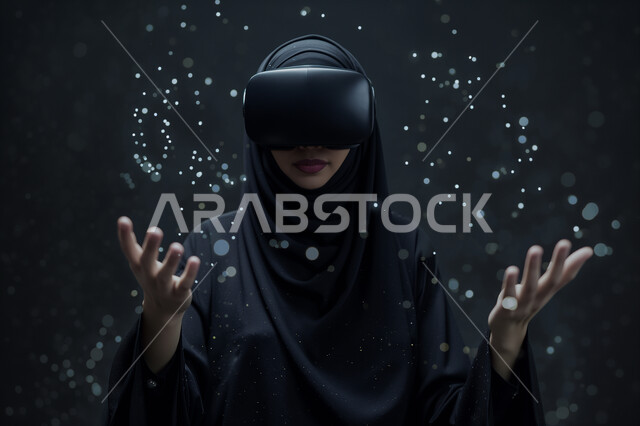 Modern electronic technologies and technological devices, wearing virtual reality glasses (VR), merging and interacting with holographic elements, close-up image of a veiled Saudi Arabian Gulf woman wearing a traditional abaya standing and raising her hand up in an attempt to touch the imaginary components, black background