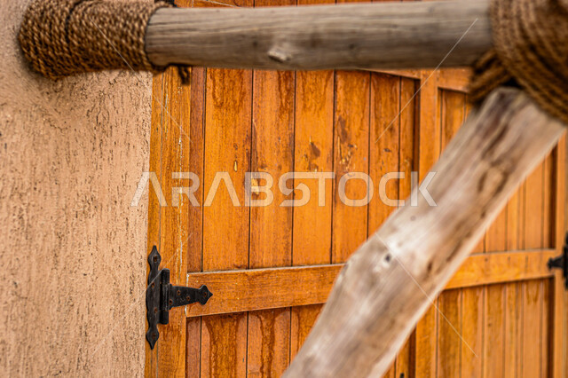 The former ruling family palace in Ajman, authentic Arab heritage and architecture in the past, wooden doors and old lanterns in Ajman Museum in the Emirate of Ajman in the United Arab Emirates, historical tourist attractions, Emirati buildings and archaeological sites, destinations that attract and attract tourists and visitors from around the world