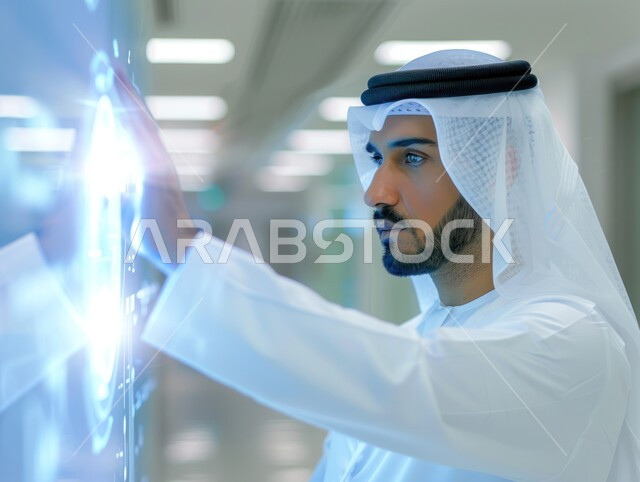 Manual interaction with digital interface, doing business using modern technological techniques, portrait of a Saudi Arabian Gulf man pointing to a touch screen, concept of business and economic development, improving work efficiency and reducing company costs, illuminated electronic screens