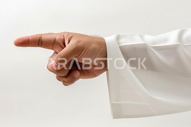 Pointing towards something and specifying a target, close-up portrait of a Saudi Arabian Gulf man's hand wearing a traditional thobe pointing with his index finger to a specific place, white background