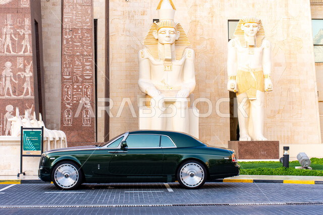 Traffic movement of transportation on the roads, the concept of selling and renting cars, distinguished events and exhibitions, famous landmarks and tourist places in the United Arab Emirates, a Rolls Royce car in the private parking lot next to Wafi Mall, expensive luxury cars in the Emirate of Dubai