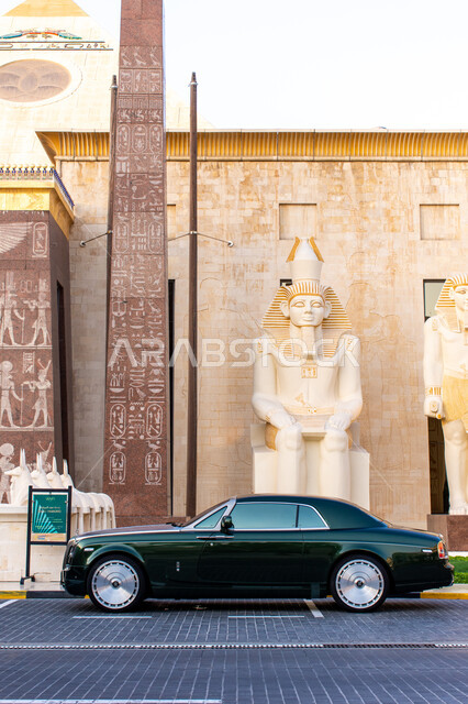 Car sales and rental concept, distinguished events and exhibitions, expensive luxury cars in the Emirate of Dubai, traffic movement of transportation on the roads, famous landmarks and tourist places in the United Arab Emirates, a Rolls Royce car in the private parking lot next to Wafi Mall