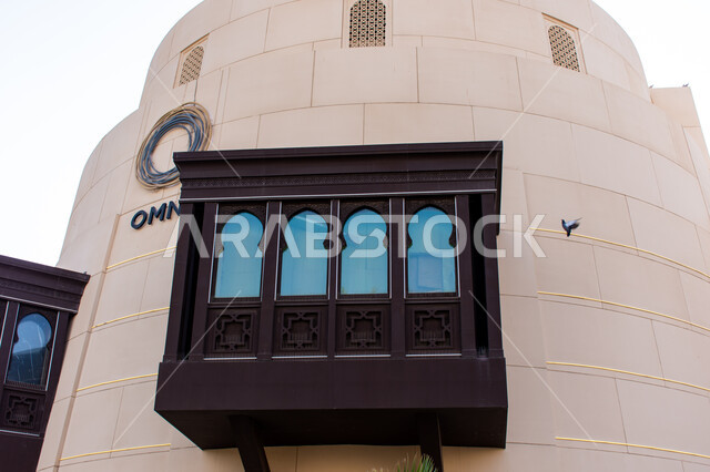 Balconies of an Islamic style building next to Wafi Mall in Dubai, Islamic architecture of wooden windows, urban growth and development in Dubai, modern architecture in the United Arab Emirates, famous tourist places and landmarks