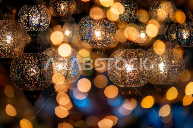Islamic art for decoration and accessories, Arabic metal lantern decorated with light, traditional Islamic lanterns and artifacts to celebrate the arrival of the month of goodness, decorations and lights in the spiritual Ramadan atmosphere, greeting card to celebrate the arrival of the holy month of Ramadan