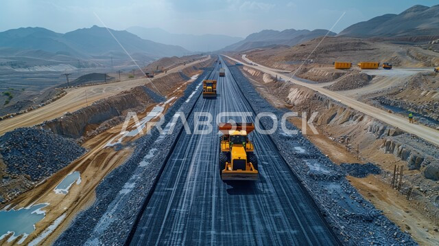 تعبيد الشوارع الرئيسية، مفهوم الهندسة والبناء والتحسين، الأعمال الإنشائية وتطوير المدن في المملكة العربية السعودية، مد الاسفلت بشكل مستوي في الطرقات باستخدام الآلات الثقيلة والجرارات، التقدم الحضاري والعمراني