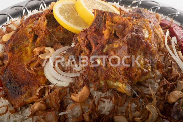Popular rice dish with dazzling meat prepared in Saudi kitchen, meat sacrifice, Saudi folk food, decorated traditional Saudi dish, ready-made traditional Saudi kitchen, white background