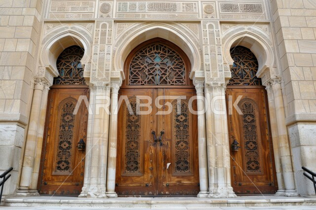 Ornate doors of a historic building, Islamic design, finely carved decorations and inscriptions, interior decorations of wooden doors, geometric art in the Islamic style