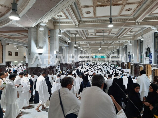 Visiting the Holy House of God in Mecca, a group of pilgrims in the Holy Mosque, performing Hajj and Umrah rituals, sacred Islamic religious places and landmarks in the Kingdom of Saudi Arabia, the fifth pillar of Islam