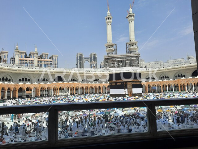 Pilgrims gather in the courtyards of the Grand Mosque in Mecca, performing Hajj and Umrah rituals, worshipping and drawing closer to God, sacred Islamic religious places in the Kingdom of Saudi Arabia.