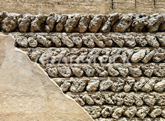 صورة خلفية لجدار حجري قديم بارز الشكل