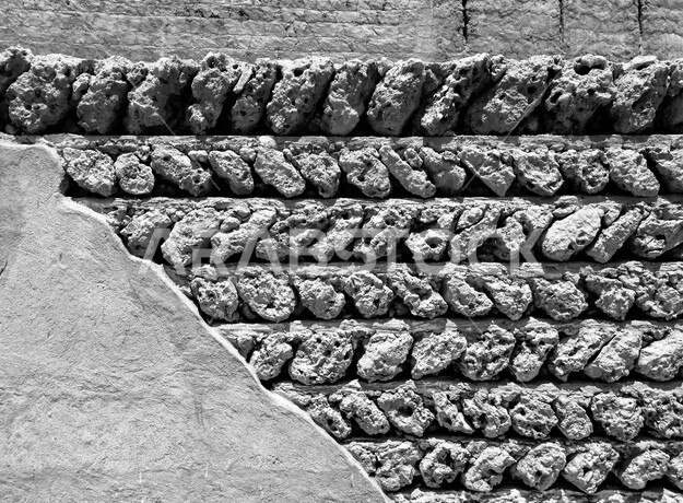 صورة خلفية لجدار حجري قديم بارز الشكل