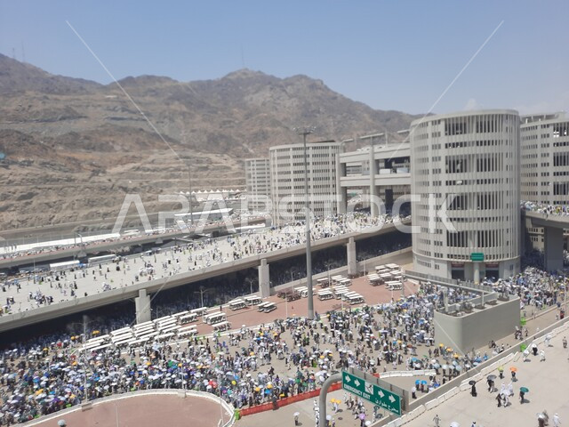 Visiting the Holy House of God, a group of pilgrims walking on the Jamarat Bridge in Mecca, performing Hajj and Umrah rituals, sacred Islamic religious places and landmarks in the Kingdom of Saudi Arabia