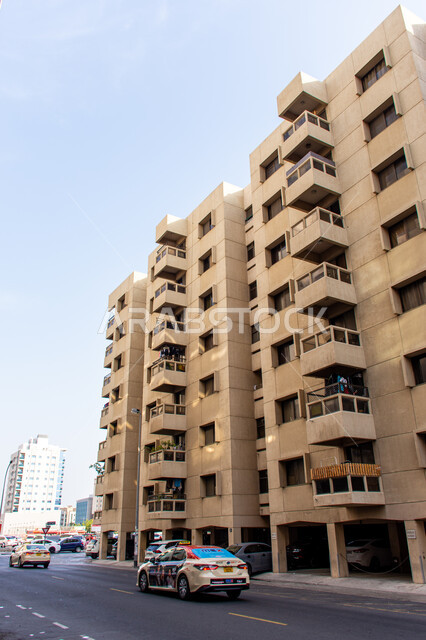 Architectural engineering art of residential and commercial buildings and facilities, urban progress and expansion in the United Arab Emirates, towers and skyscrapers in the city of Dubai, traffic movement in the streets and roads
