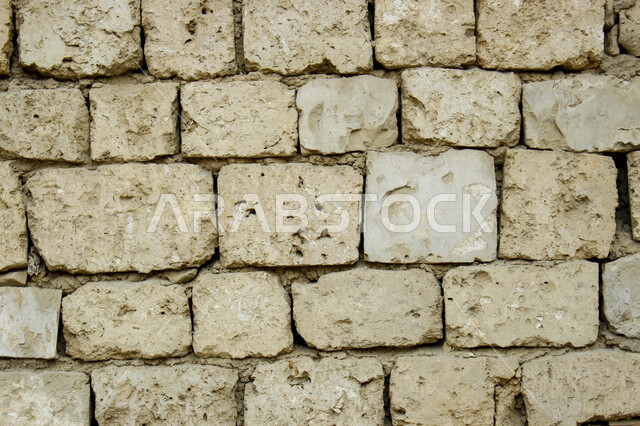 صورة خلفية لجدار حجري قديم بارز الشكل