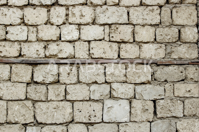 صورة خلفية لجدار حجري قديم بارز الشكل