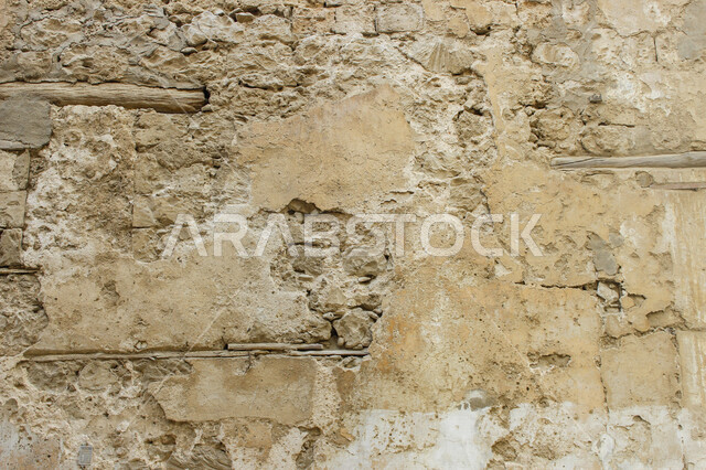 صورة خلفية لجدار حجري قديم بارز الشكل