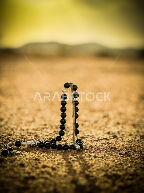 Striving in worship and drawing closer to God in the blessed month of Ramadan, a close-up image of a black rosary, frequently mentioning God Almighty, seeking forgiveness and supplication, repeating the daily supplications and prayers and performing acts of worship