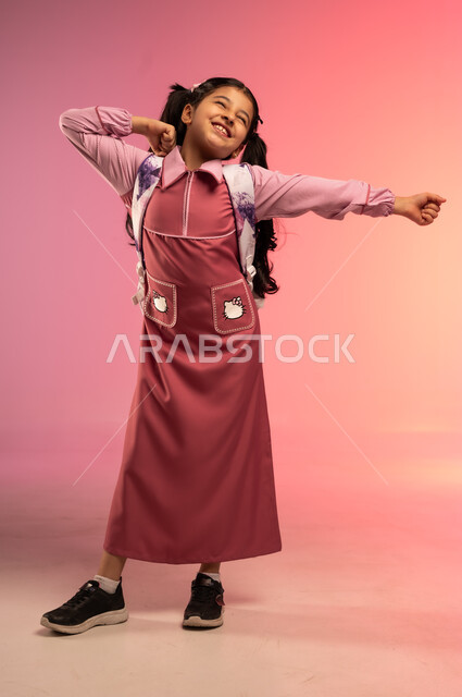 Waking up early to go to school, preparing for the new school year, education in Saudi Arabia, portrait of a Saudi Arabian Gulf girl in school uniform doing morning exercises, full body, colorful background