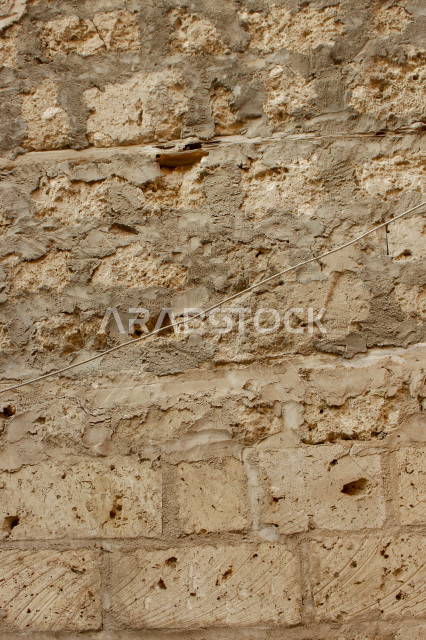 صورة خلفية لجدار حجري قديم بارز الشكل