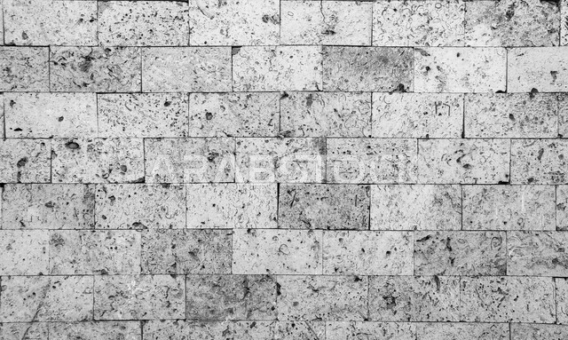 صورة خلفية لجدار حجري قديم بارز الشكل