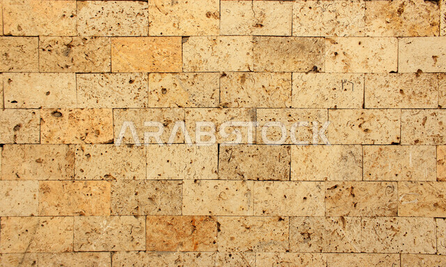 صورة خلفية لجدار حجري قديم بارز الشكل