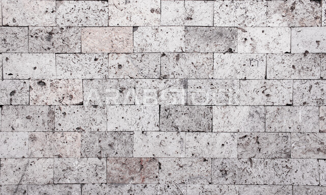 صورة خلفية لجدار حجري قديم بارز الشكل