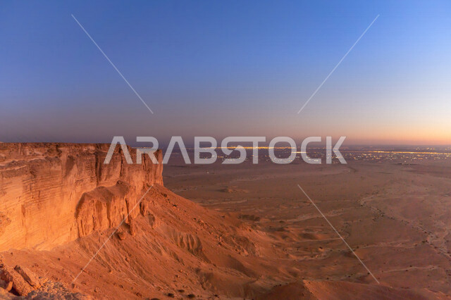 A stunning aesthetic picture of orange sunset and sunrise, creative sunset and sunrise from the desert, beauty of the scenic desert nature in Saudi Arabia, a picture of the beautiful natural rock formation, tourist places