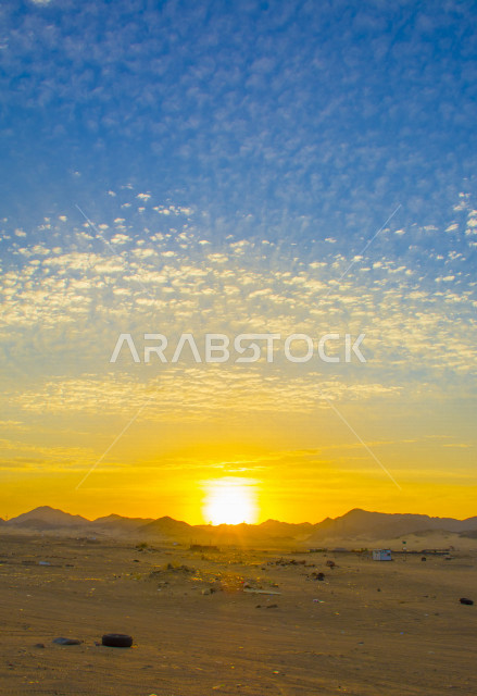 A stunning aesthetic picture of orange sunset and sunrise, creative sunset and sunrise from the desert, beautiful desert nature at sunset and sunrise, a wonderful and breathtaking view in the sky of Saudi Arabia