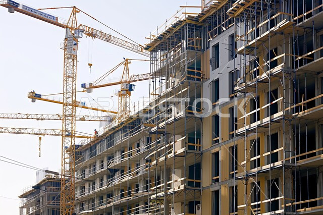 Working on developing and improving the country, the concept of structural and architectural engineering, implementing the construction plan and forming the metal structure, construction cranes and pouring concrete, skyscrapers and towers on a site under construction in Saudi Arabia