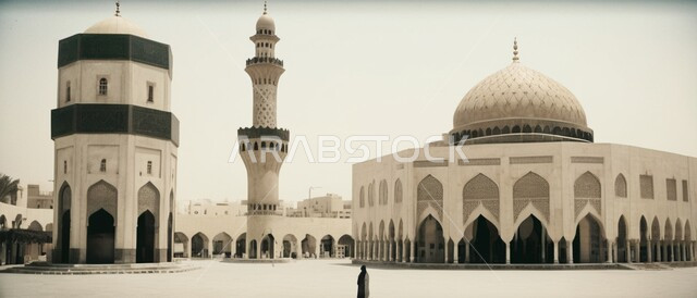 مفهوم العبادة والتقرب الى الله ,صورة بانورامية لأحد المساجد في المملكة العربية السعودية ,أداء الفرائض والصلوات ,أماكن دينية مقدسة ،مدينة عربية إسلامية قديمة ،المآذن والقبب على الطراز العصري